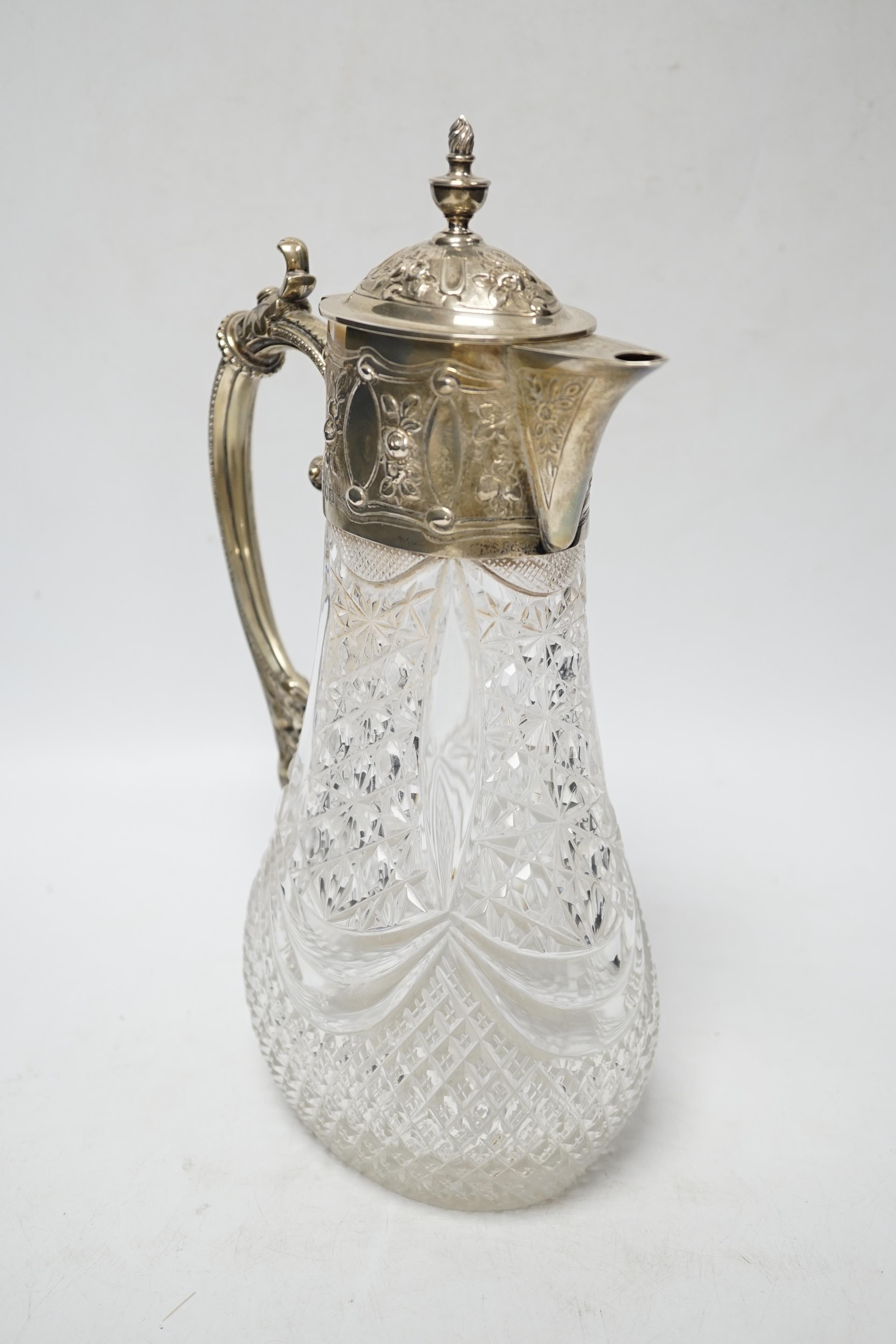 A late Victorian silver mounted cut glass claret jug, Hukin & Heath, London, 1896, 27.8cm.